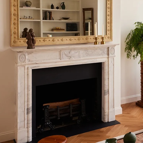Apartment with marble fireplace from Architectural Digest