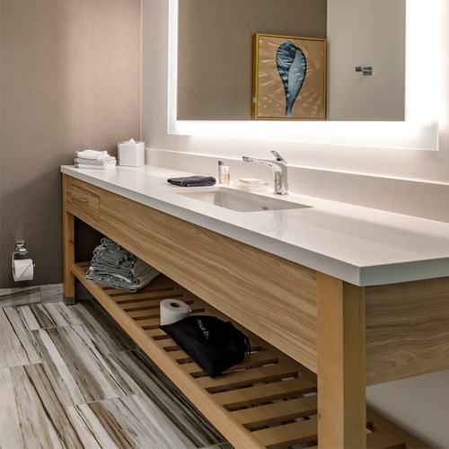 Bath vanities with wood base in Cambria Hotel