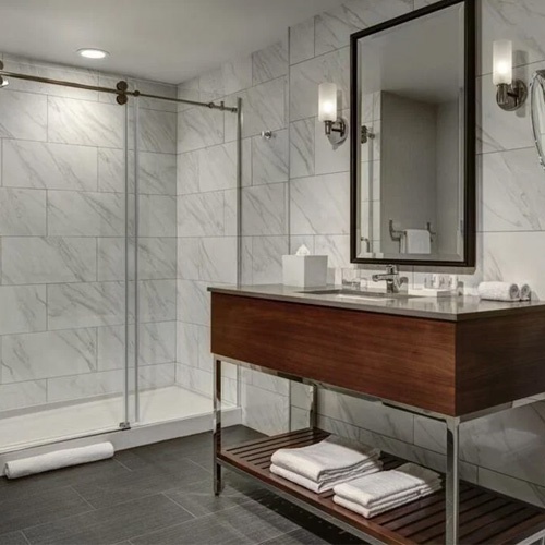Bathroom vanity and shower in Le Meridien hotel by Marriott