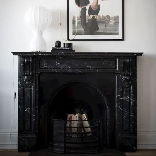 Black Marble Fireplace and Whimsy Artwork
