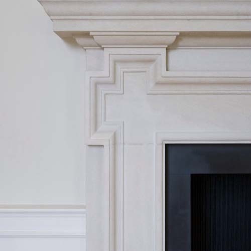 Greek revival limestone fireplace mantel