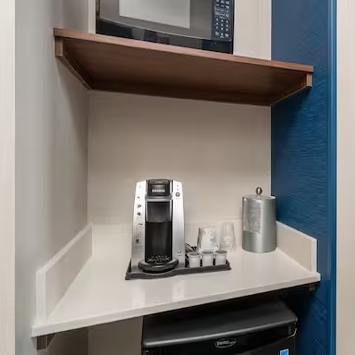 Hospitality Center by Quartz and Wood Shelf in Holiday Inn Express