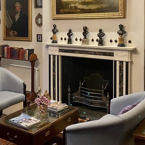 Regency period marble chimneypiece in a library