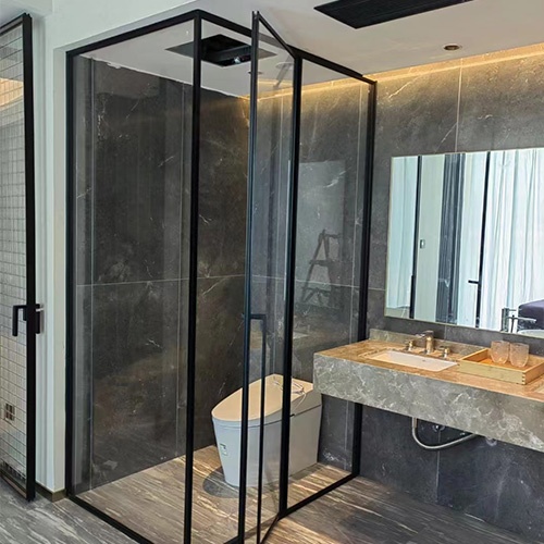 Shower Room by Glass Panel and Door in Hotel Bathroom
