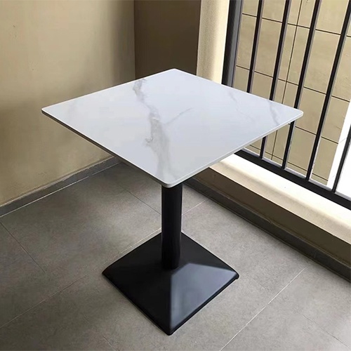 Table with metal base and artificial stone top
