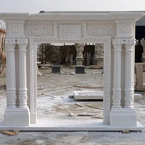 White marble fireplace mantel with fluted column and decorative capital and base