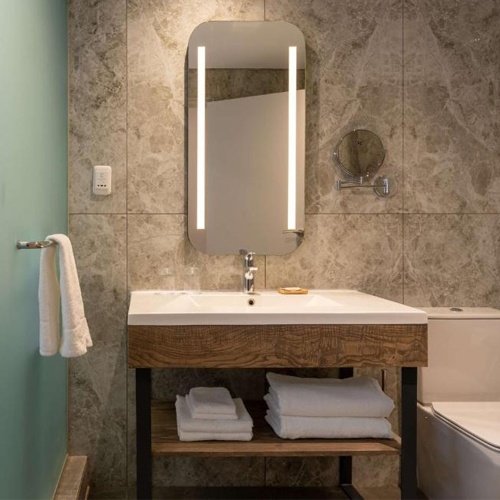 matte black metal base vanity with plywood apron