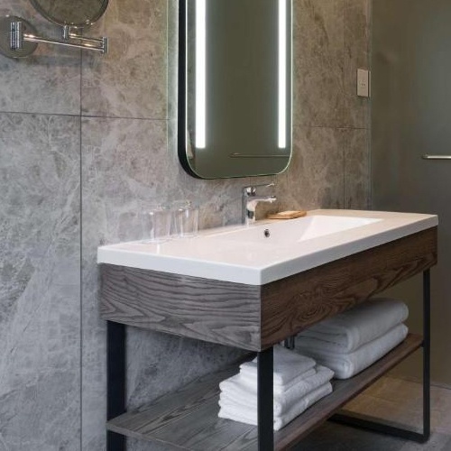 matte black metal base vanity with plywood apron