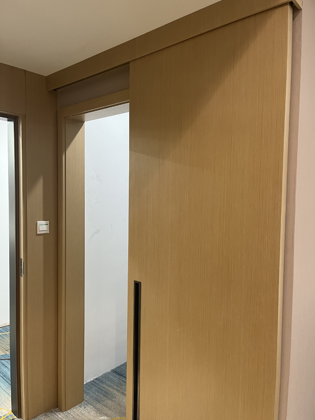 sliding flush wood barn door with jamb casing and valance
