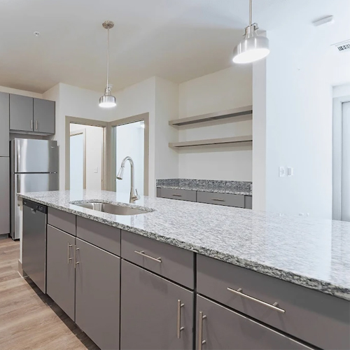 grey granite kitchen countertop and plain style cabinetry