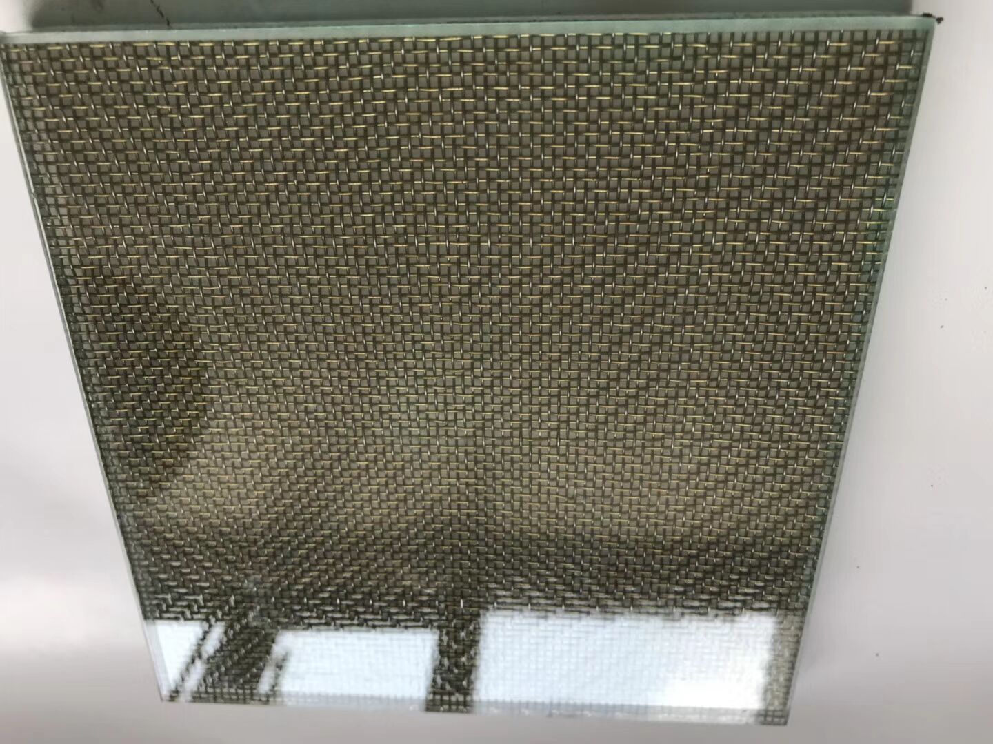 Metal mesh glass installations