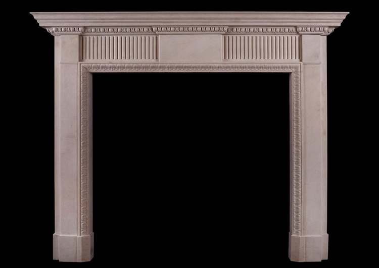 A LIMESTONE FIREPLACE IN THE LATE GEORGIAN MANNER