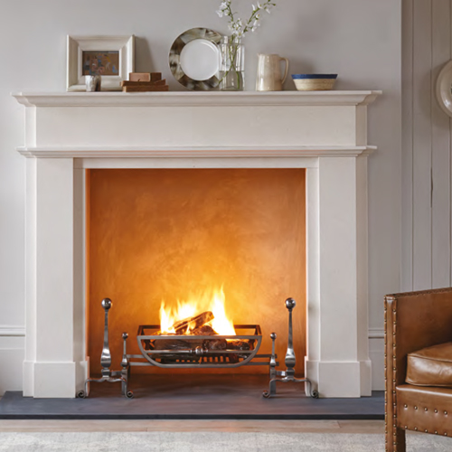 panelled limestone fireplace