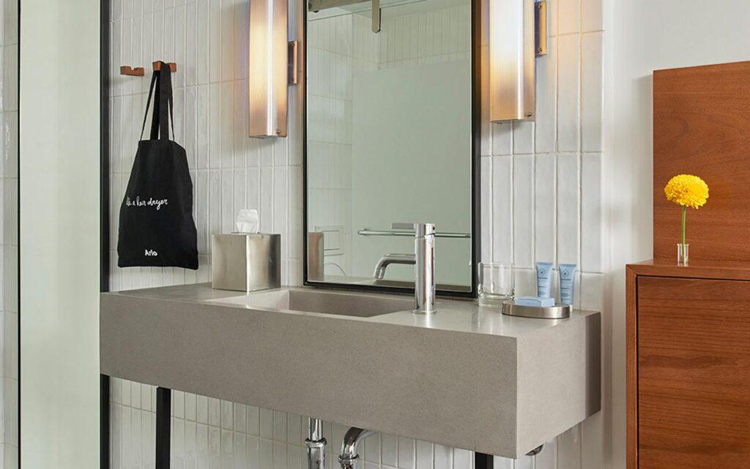 concrete bathroom vanity in Arlo hotels New York