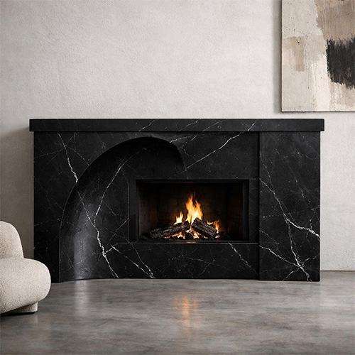 white veined black marble fireplace