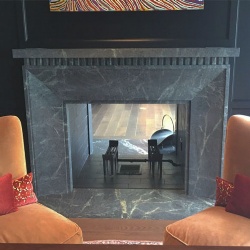 Adorned honed grey marble fireplace mantel