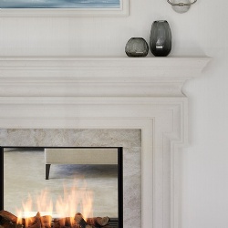 Bespoke double sided limestone fireplace mantel for master bedroom