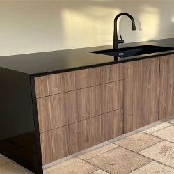 Black galaxy granite countertop with oak cabinet base