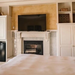 Carrara white marble fireplace mantel in mendocino boutique hotel spa suite