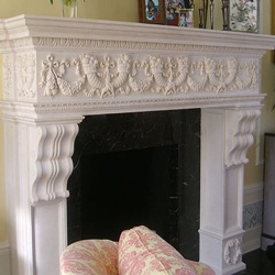 Custom limestone and marble fireplace