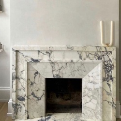 Decorative marble fireplace mantel and surround
