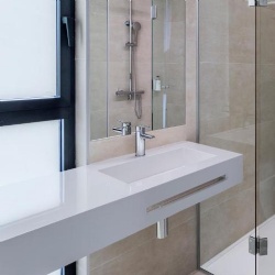 Floating bathroom solid surface counter and integrated basin for B&B hotel