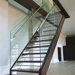 Frameless glass railing with monolithic tempered glass and minimal hardware