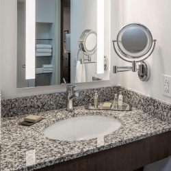 Granite bath vanity top and wood apron