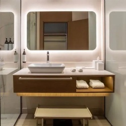 Hotel bath vanities with floating wood vanity and frameless vanity mirror