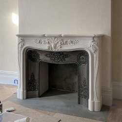 Louis XV fireplace surround in white statuary marble