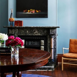 Low maintenance darker marble fireplace mantel