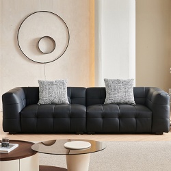 Modern tufted modular sofa with accent pillow