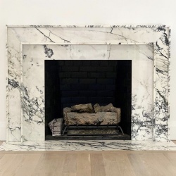 Polished Paonazzo marble fireplace design
