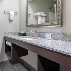 Quality Inn Bath Vanities with Light Grey Granite top and Floating Wood Base