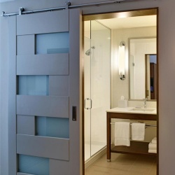 Stylish barn door Four Points by Sheraton Bathroom