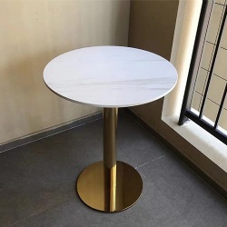 Table with metal base and artificial stone top