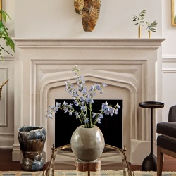 Tudor style limestone fireplace mantel