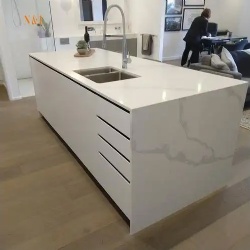 Waterfull quartz kitchen benchtop and white lacquered cabinetry