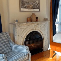 White Carrara marble arched fireplace mantel for Bedroom in Christopher Dodge House