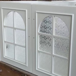 bathroom vanity cabinet door by floral textured glass insert