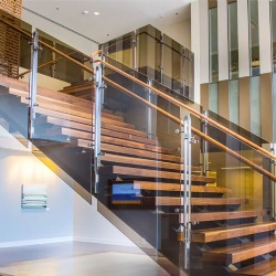 bronze tined glass for hotel stair railing