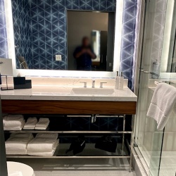 chrome polished metal bath vanity with tempered glass towel shelf