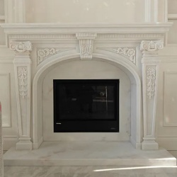 custom carved natural stone fireplace surround
