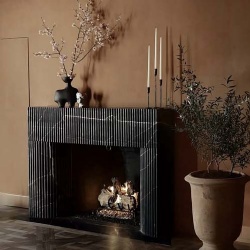 fluted black marble fireplace surround