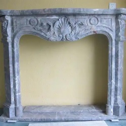 grey marble fireplace mantel with floral carving