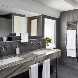 metal base bath vanity with marble top and apron