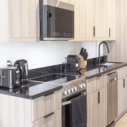 modern kitchen with black granite countertops