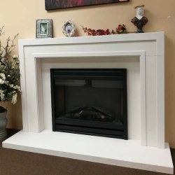 modern marble fireplace mantel with a groove running around the front face