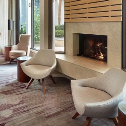 neutral tone lounge chair for hotel bedroom