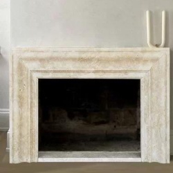 sleek fireplace mantel by beige travertine